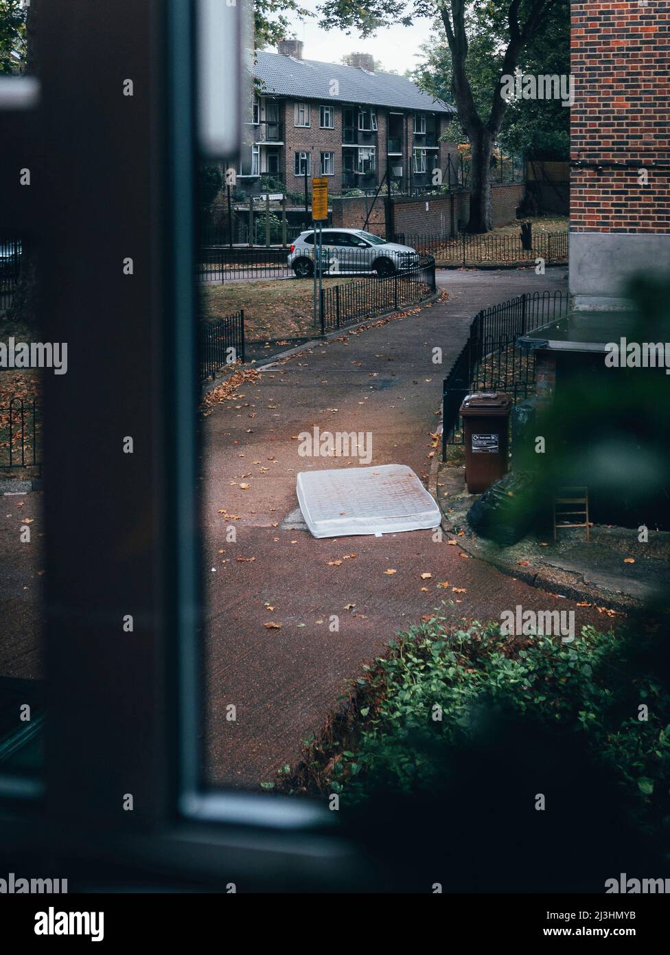 mattress on the ground in a backyard Stock Photo Alamy