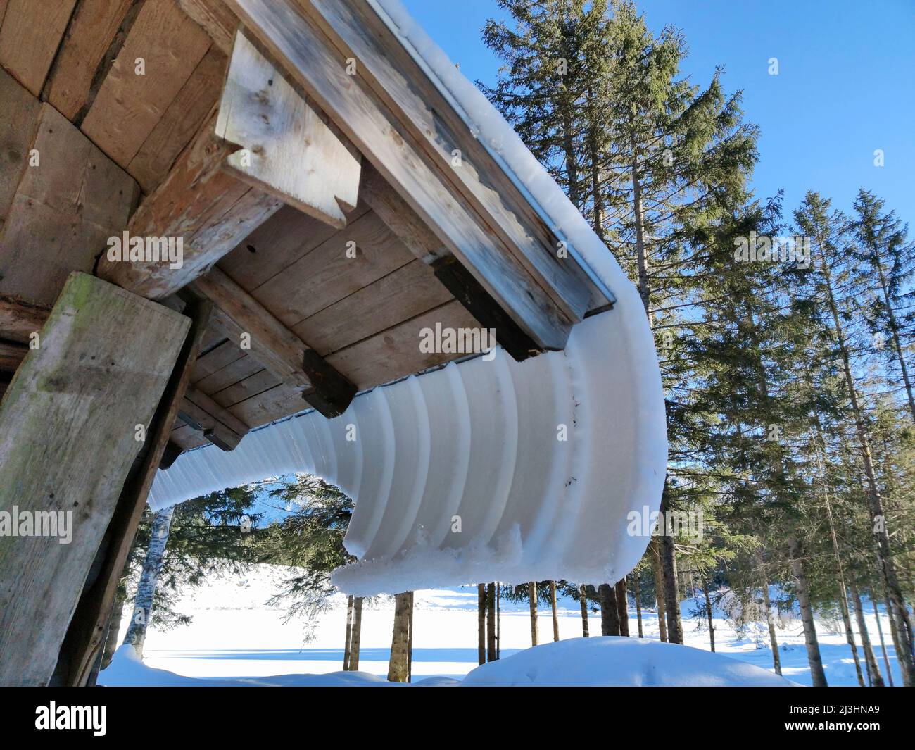 Terms from snow science are, set, creep and glide, this happens with increasing heat radiation on inclined surfaces Stock Photo