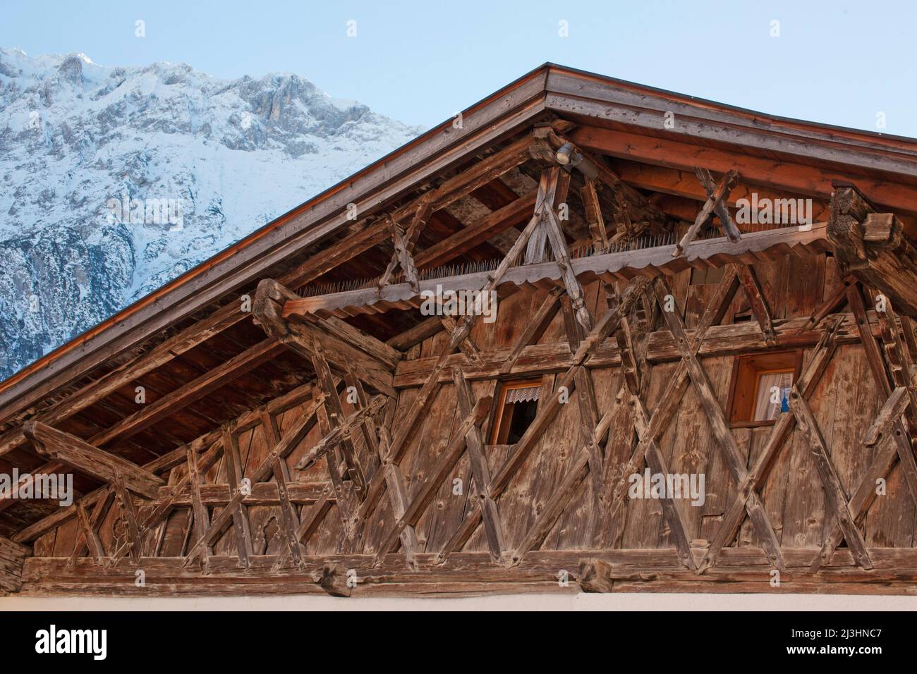 artistic old wooden construction shows this roof gable in Mittenwald, Upper Bavaria Stock Photo