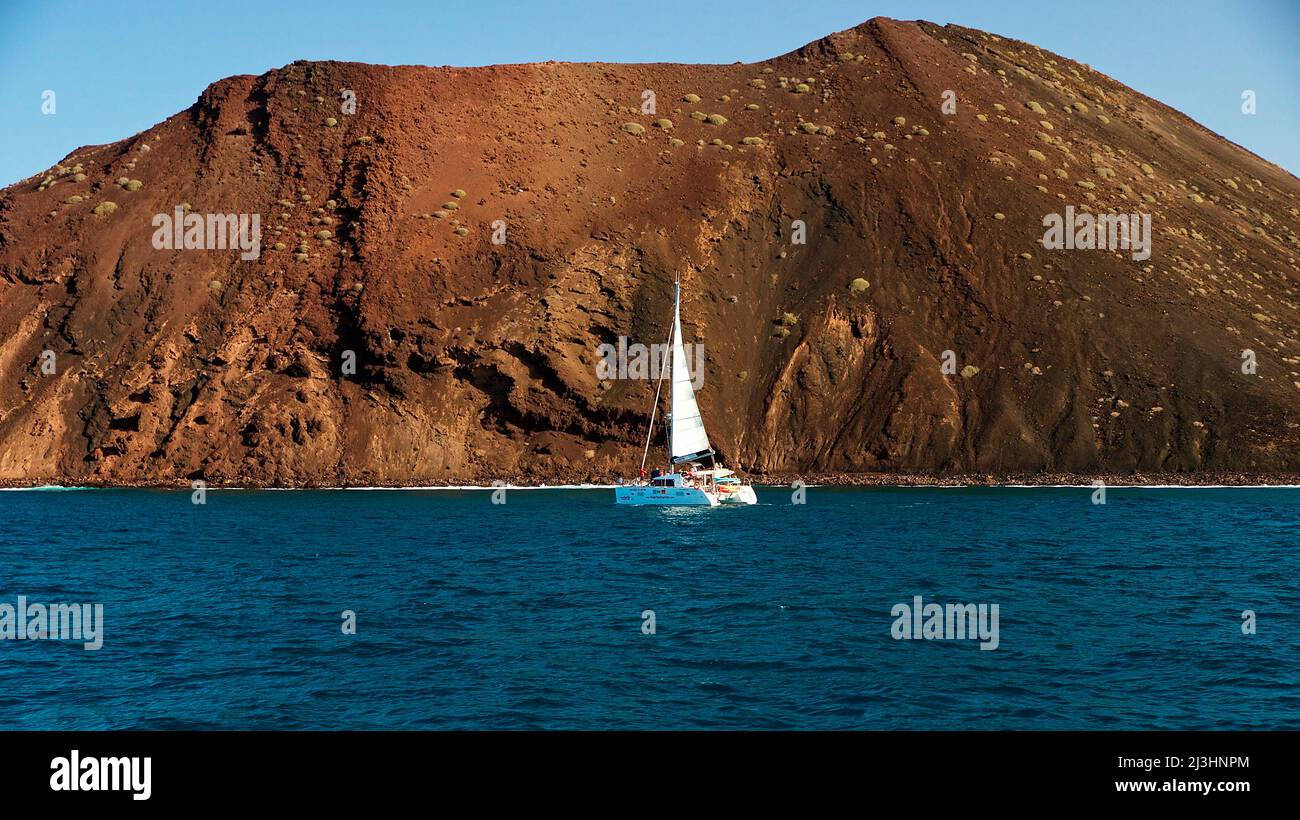Spain, Canary Islands, Fuerteventura, sailing trip, Los Lobos Island, nature reserve, catamaran in front of Los Lobos Stock Photo