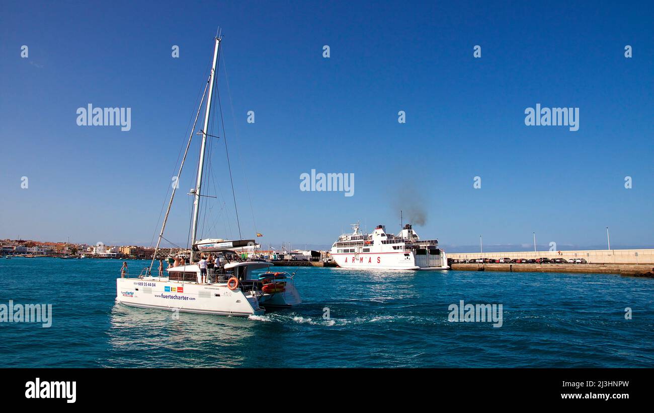 Spain, Canary Islands, Fuerteventura, sailing trip, Los Lobos island, nature reserve, Corralejo harbor, ferry, sailboat, sky blue and cloudless Stock Photo