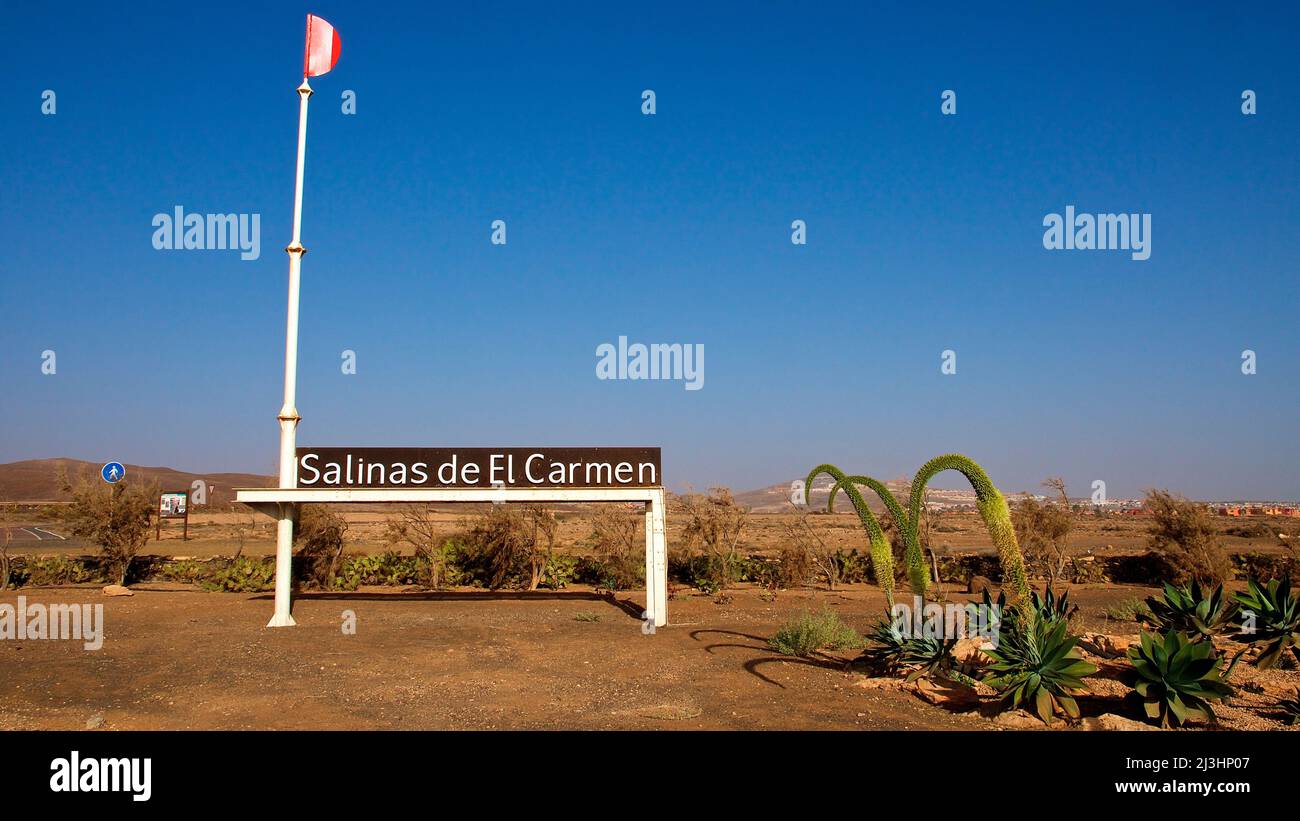 Spain, Canary Islands, Fuerteventura, east coast, Salinas de el Carmen, entrance to the Salinas, sign 'Salinas de El Carmen', sky blue Stock Photo