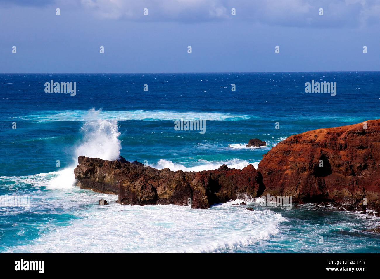 Canary Islands, Lanzarote, volcanic island, west coast, crater lake, Charco de los Clicos, lava rocks red, volcanic lake green, sky blue, clouds white, surf waves, sea blue, foaming spray Stock Photo