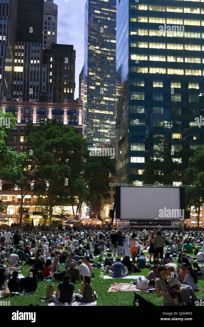 Newyorkers and tourists enjoying the bryant park summer film festival