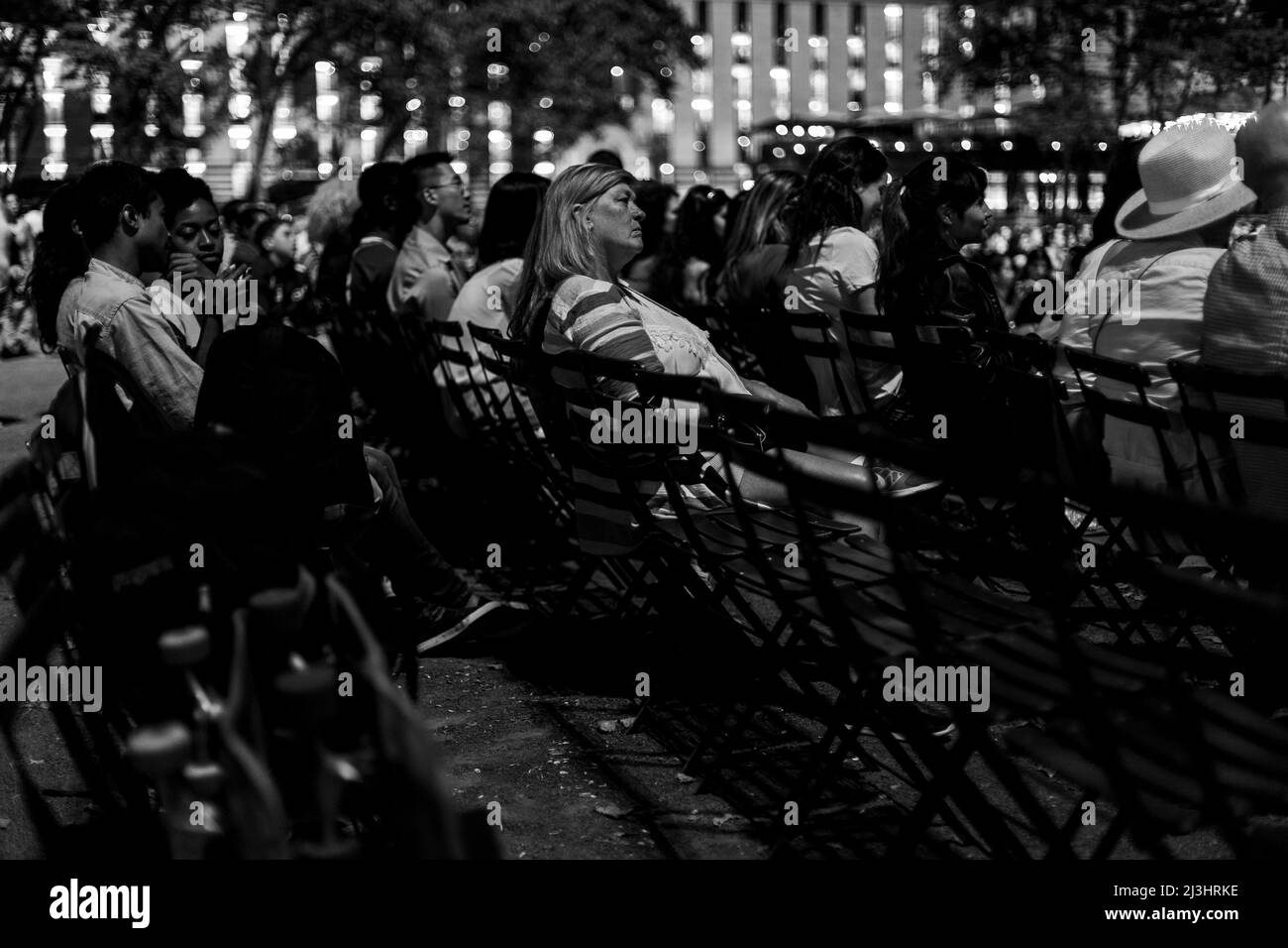 Bryant Park, New York City, NY, USA, Newyorkers and tourists enjoying the Bryant Park Summer Film Festival Stock Photo