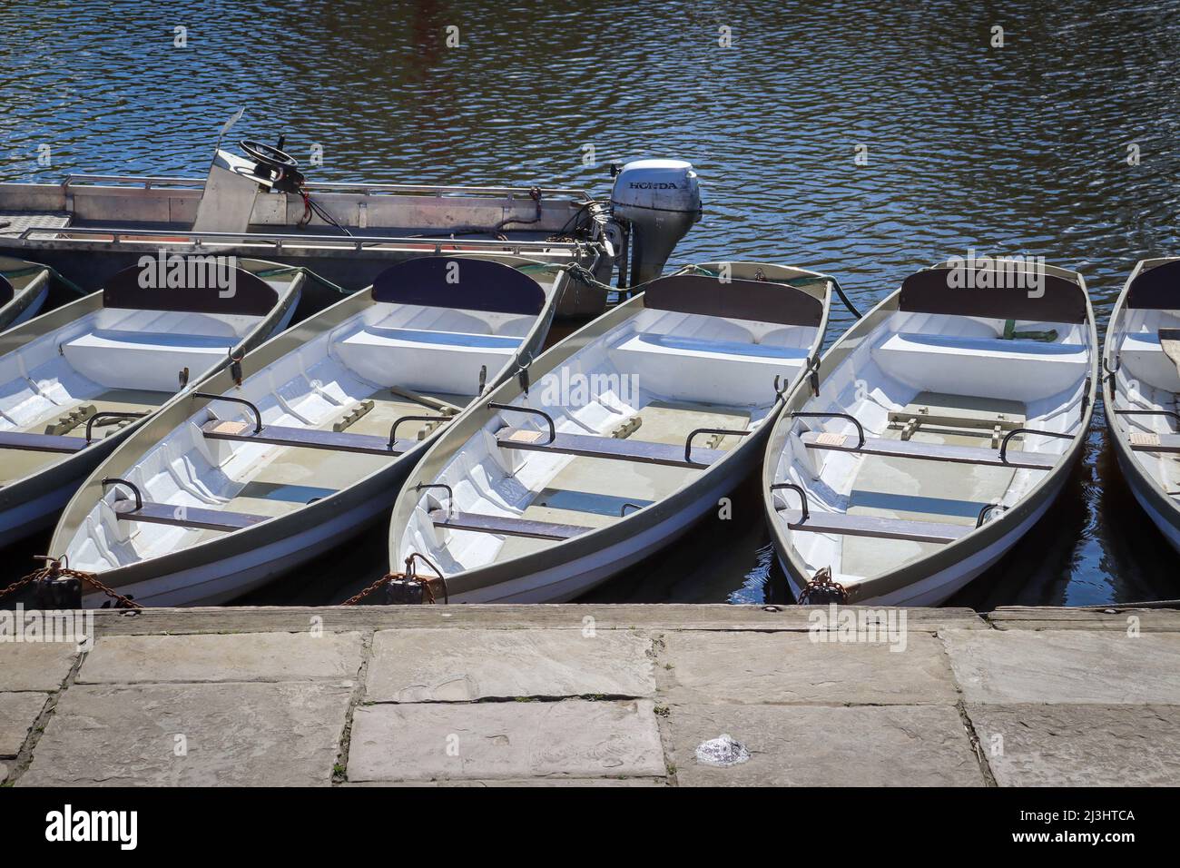 Boats for hire, row of boats on the River Dee, Chester Stock Photo