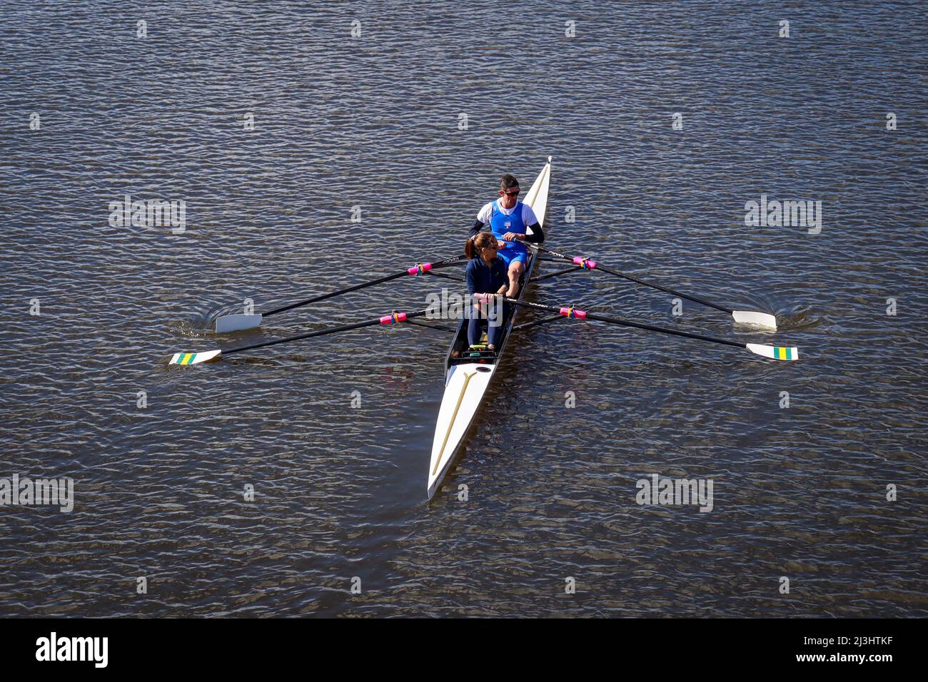 Two people rowing in a canoe on the River Dee, Chester Stock Photo