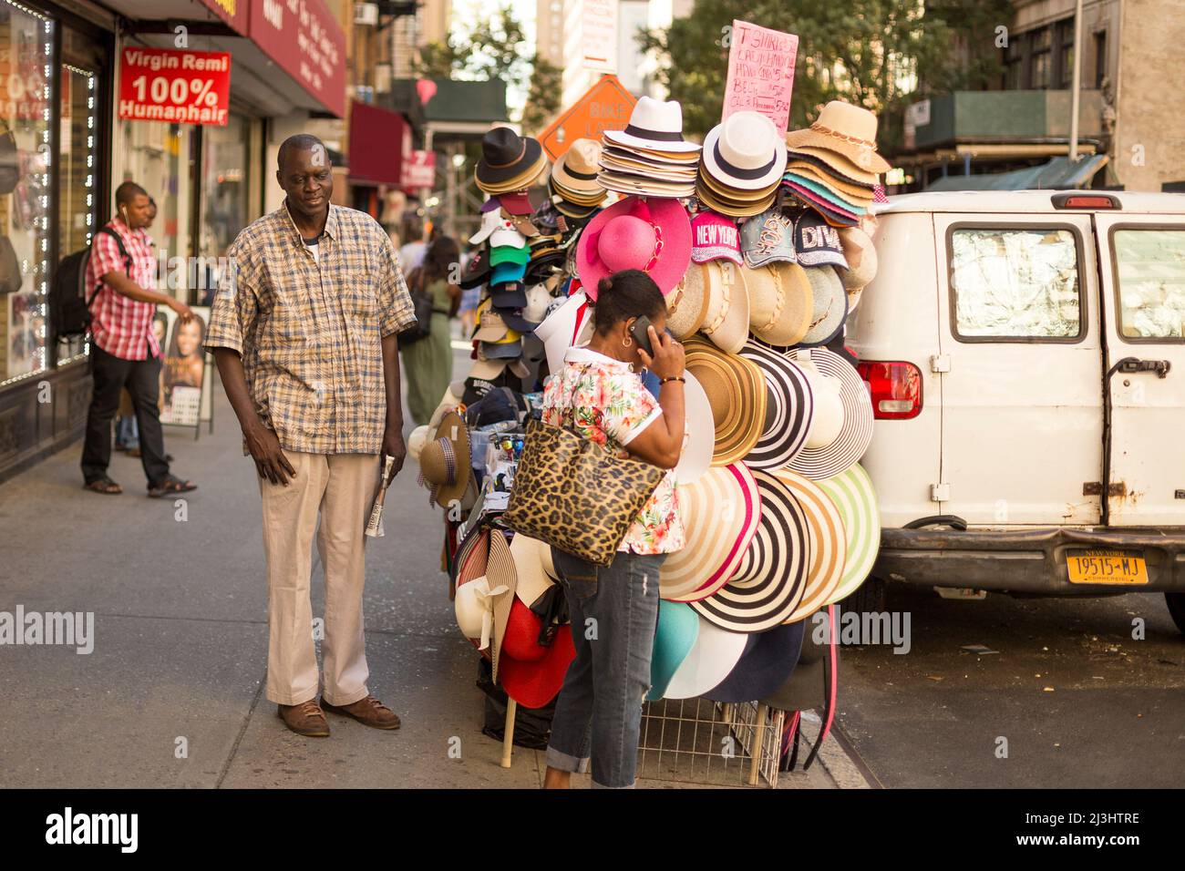 28 Street, New York City, NY, USA, A street vendor in Manhattan sells Souvenirs and Hats Stock Photo