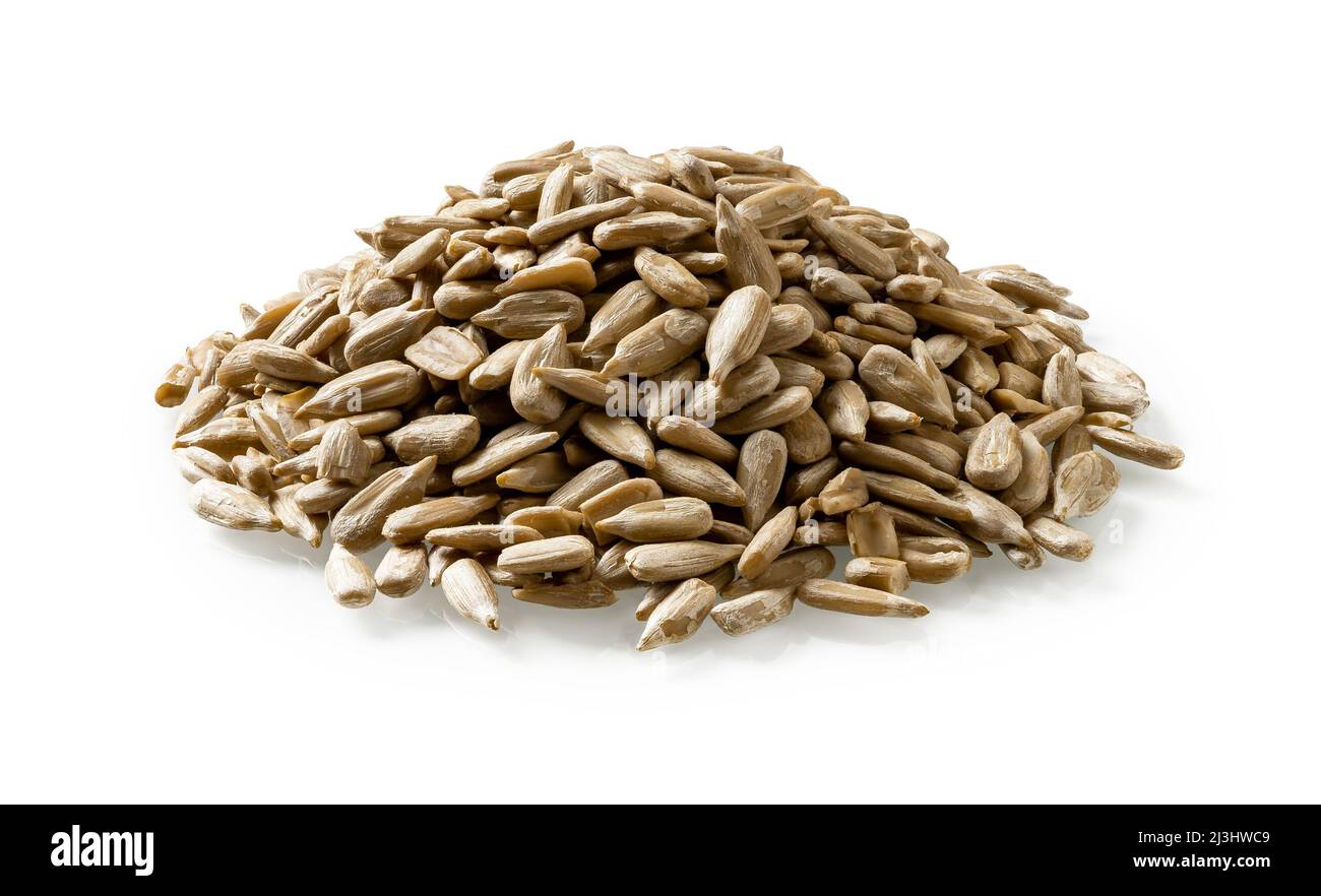 Pile of shelled raw sunflower seeds isolated on a white background