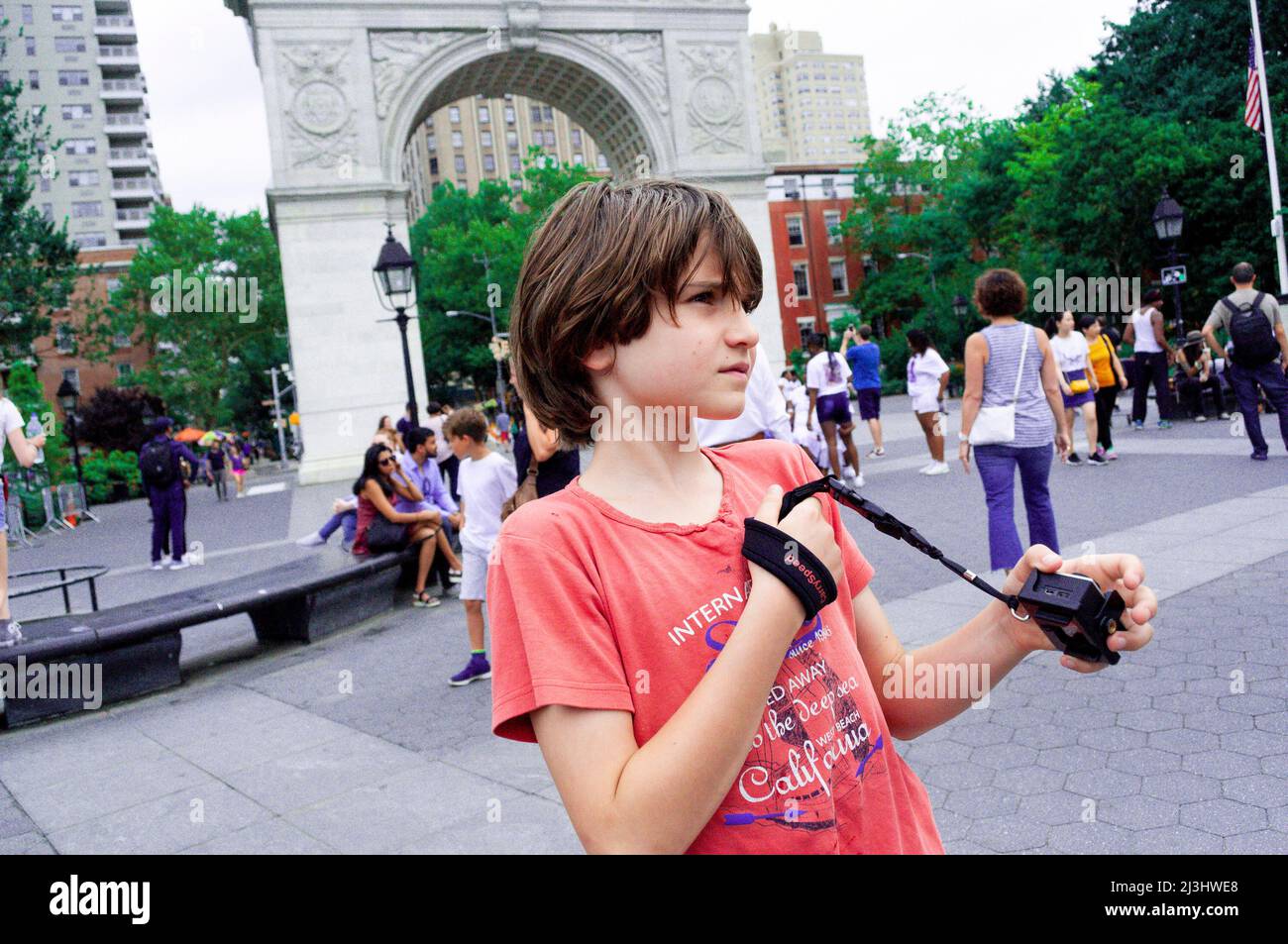 Greenwich Village, New York City, NY, USA, 12 years old caucasian teenager boy - with brown hair and in summer outfit at Washington Square Park Stock Photo