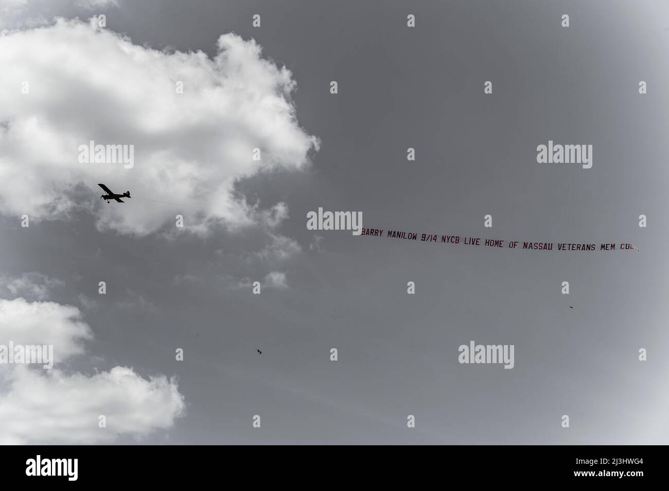CONEY ISLAND, New York City, NY, USA, Airplane with advertising above Coney Island Beach Stock Photo