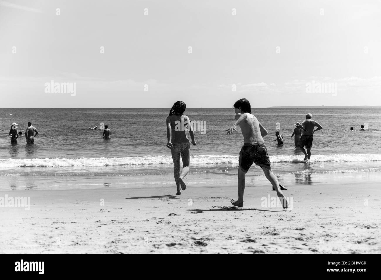 CONEY ISLAND, New York City, NY, USA, Kids covered in sand heading to the water Stock Photo