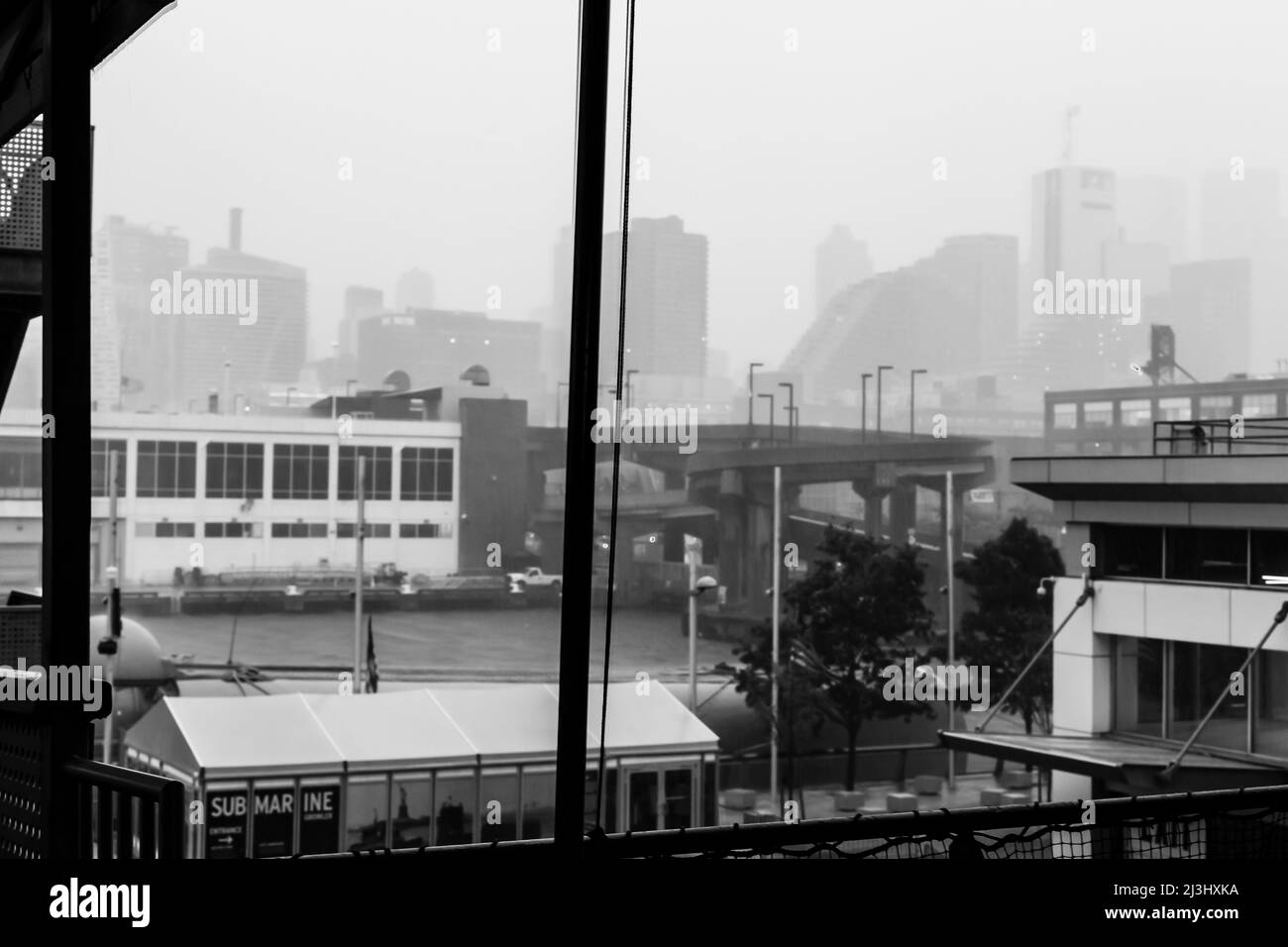 12 AV/W 46 ST, New York City, NY, USA, Foggy view at the Intrepid Sea, Air & Space Museum - an american military and maritime history museum showcases the aircraft carrier USS Intrepid. Stock Photo