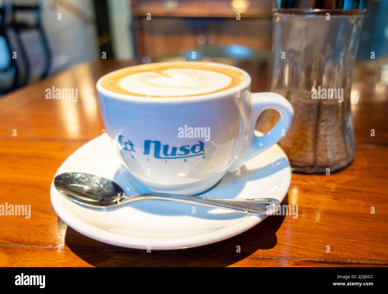 Cup of coffee in the branded cup of La Musa Latina. La Latina neighborhood, Madrid, Spain Stock Photo