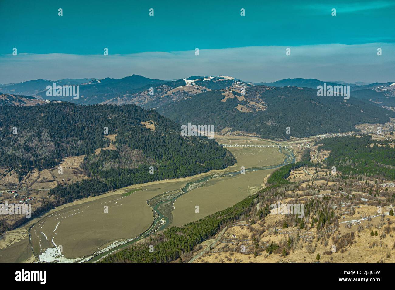 View at viaduct and river on a mountain valley with Piatra Teiului lime stone, Bicaz Lake in Romania Stock Photo