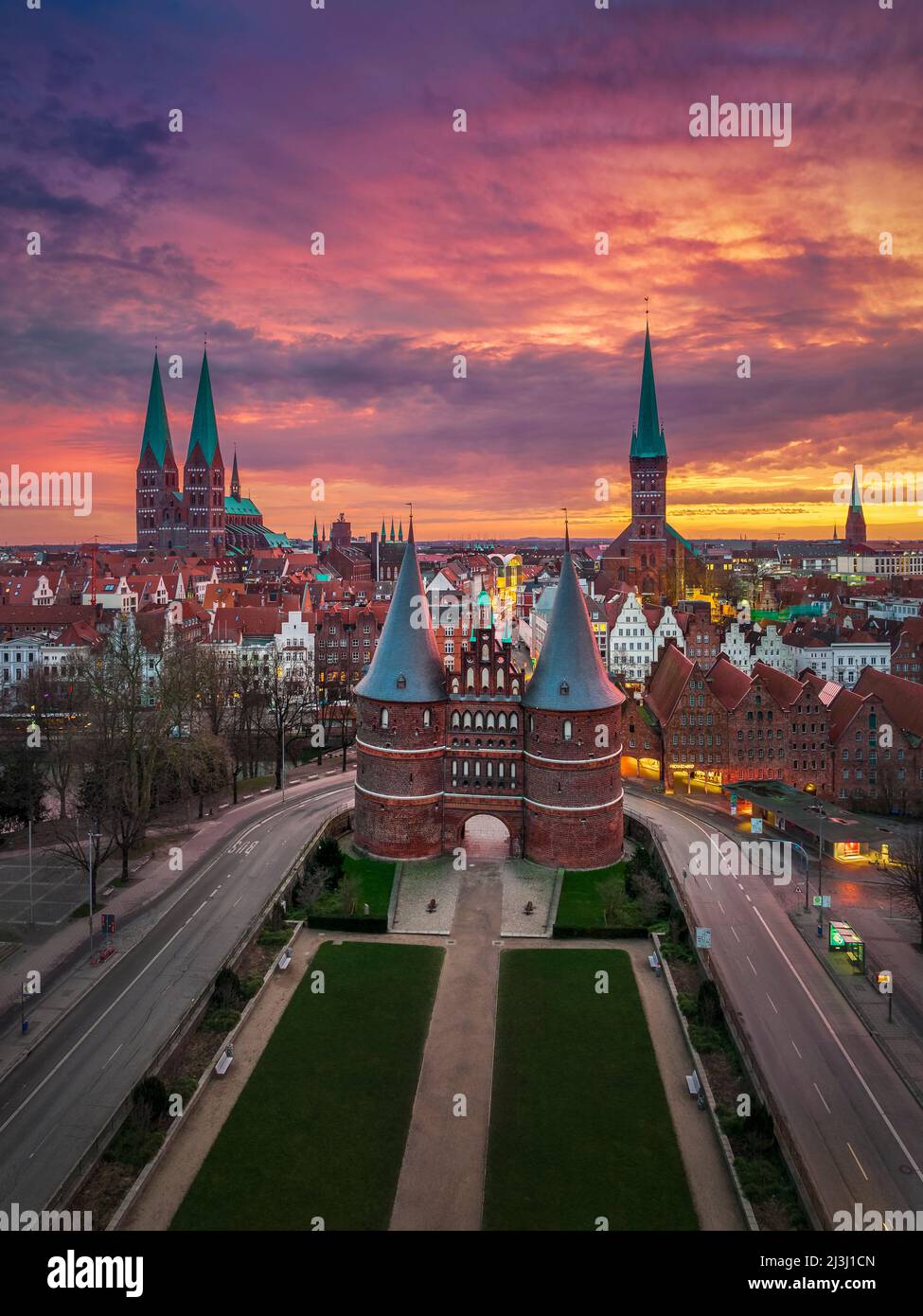 Sunrise at the Holsten Gate (Holstentor) in Lubeck, Germany Stock Photo