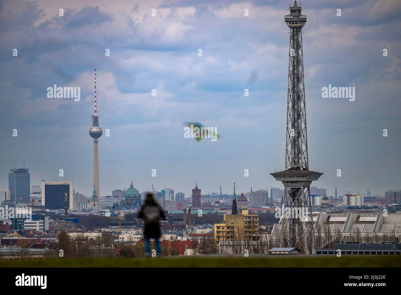 Berlin, Germany. 08th Apr, 2022. A woman stands in windy weather on the Dragon Mountain in front