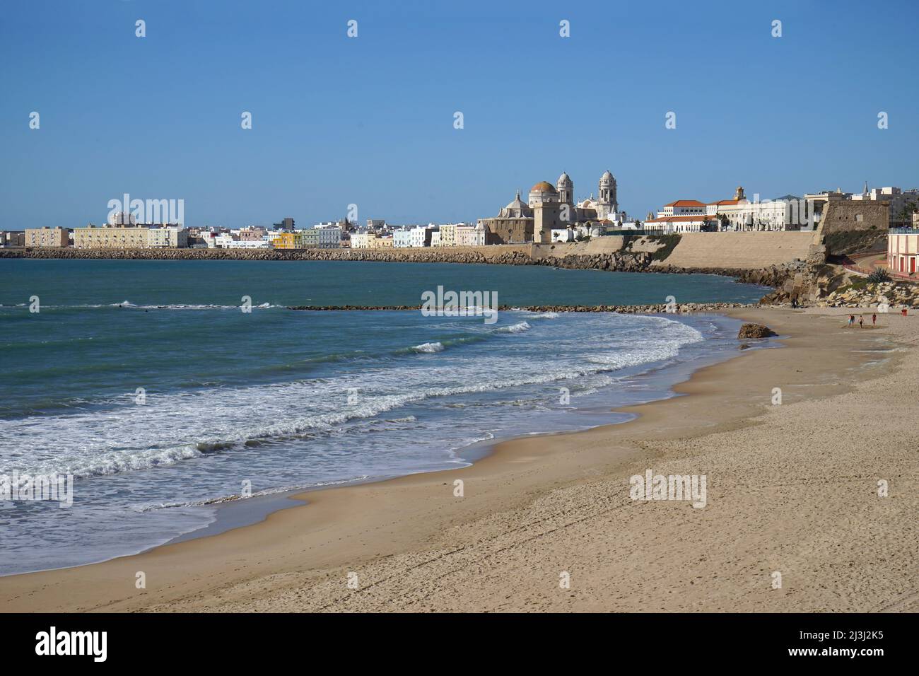 Sandy beach seafront, Cadiz, Spain with cathedral Stock Photo