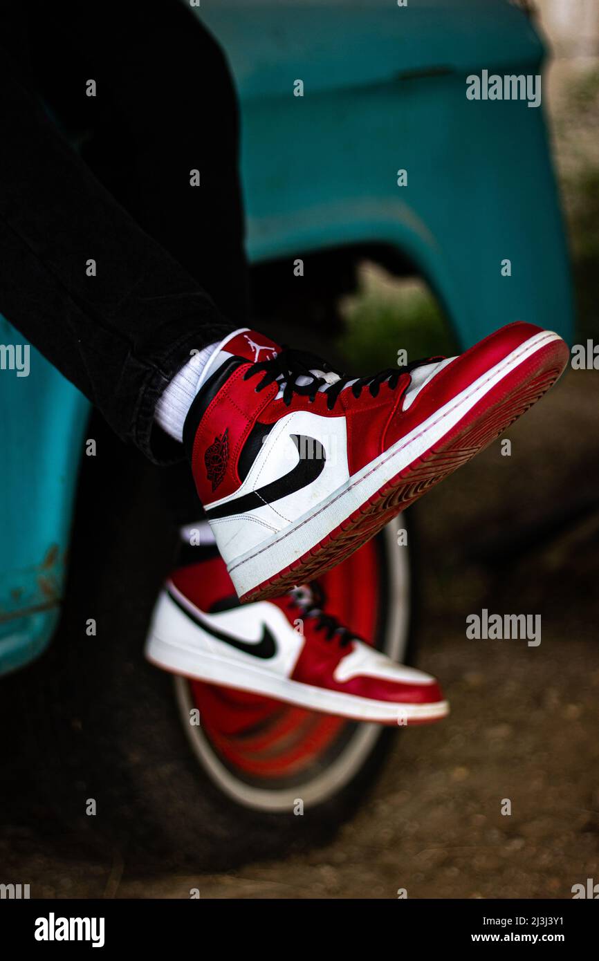 nike shoes with car in background Stock Photo