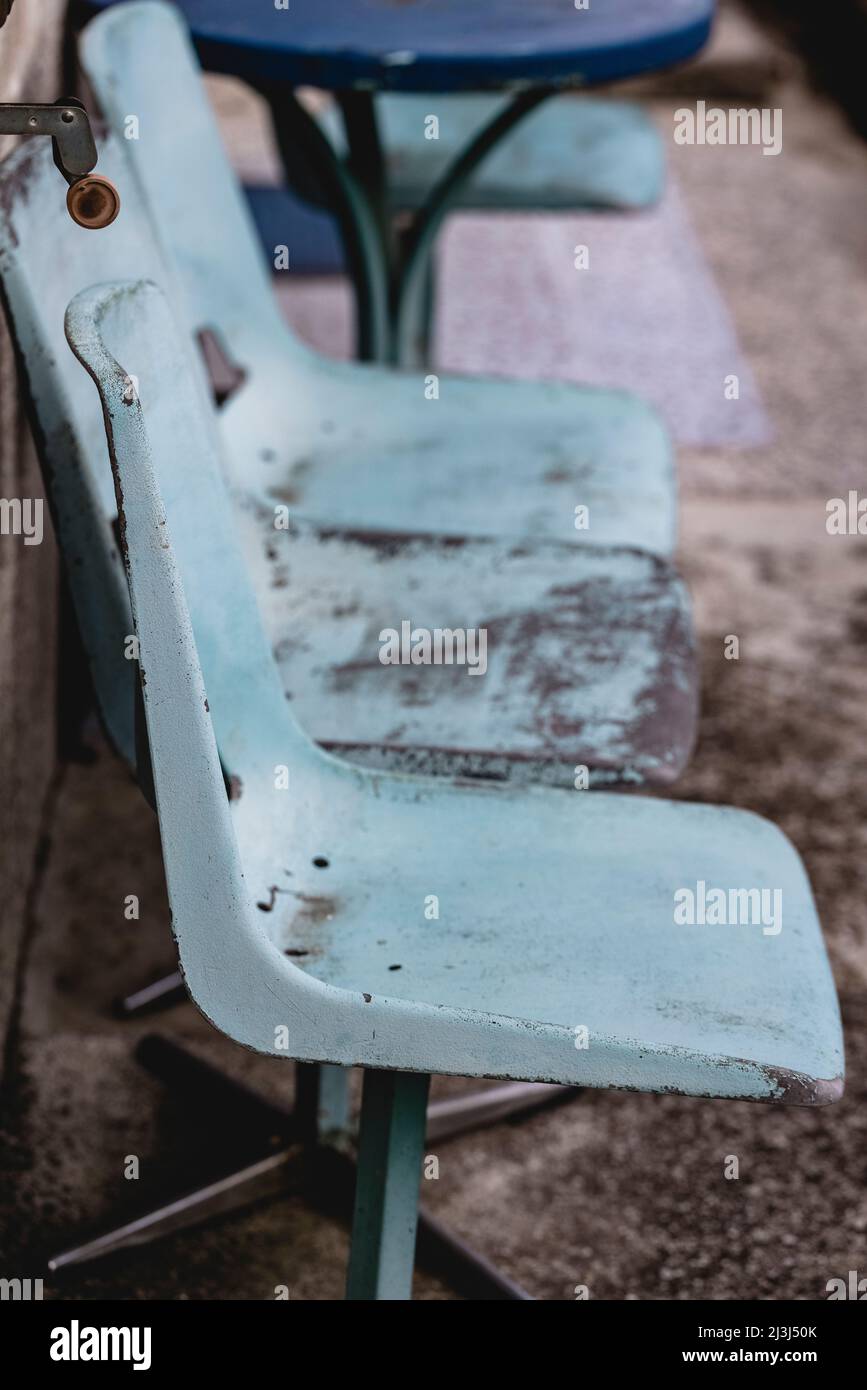 Worn blue seats in Motovun, Croatia Stock Photo