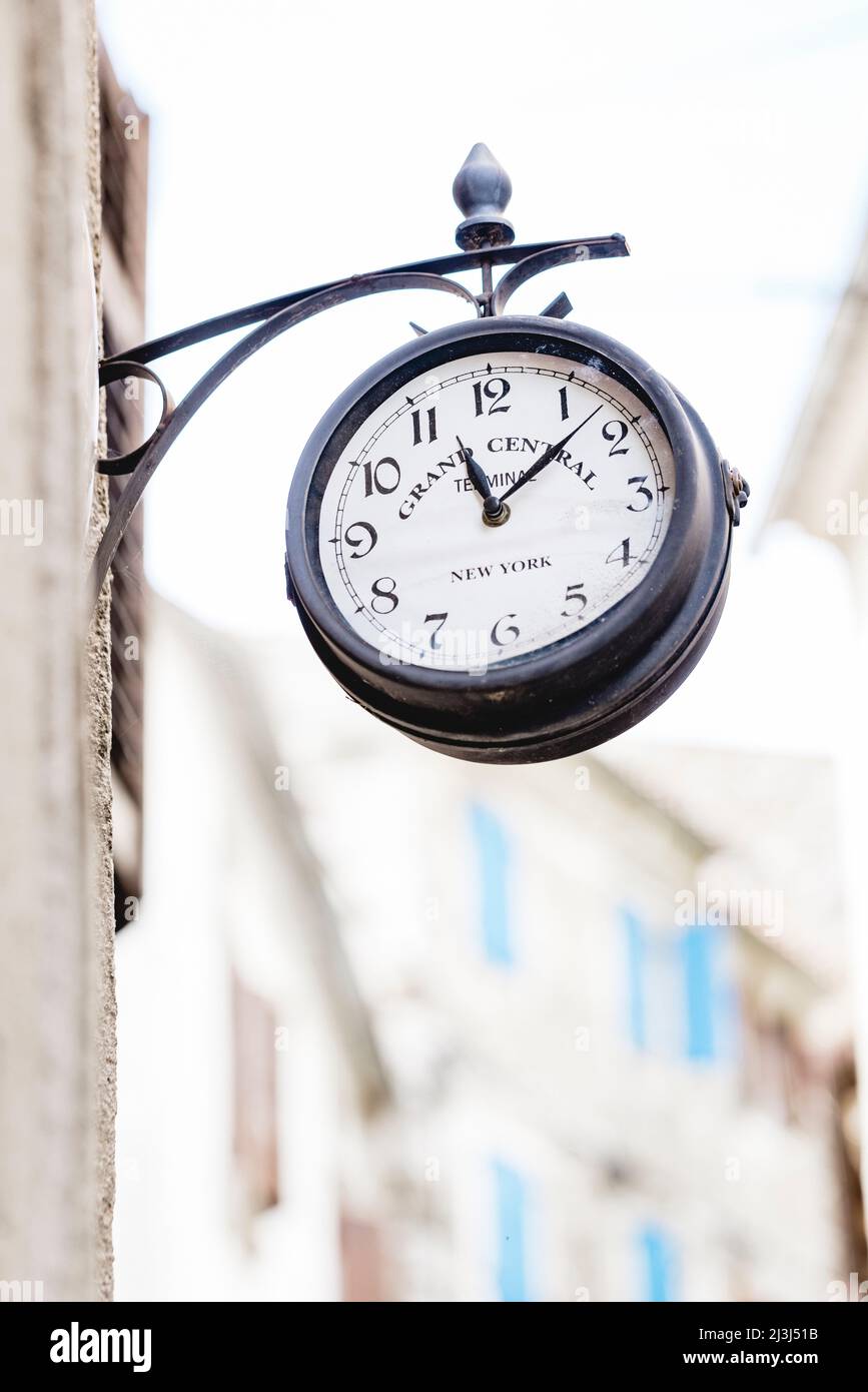 Old fashioned wall clock in the old town of Motovun, Croatia Stock Photo