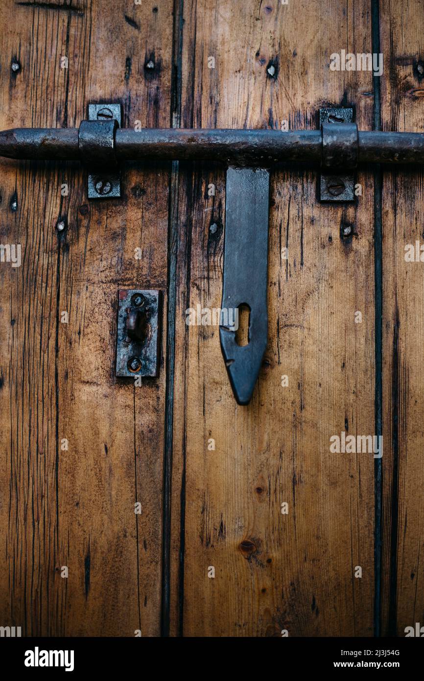 Solid metal bolt on an old wooden door in Mallorca, Spain Stock Photo