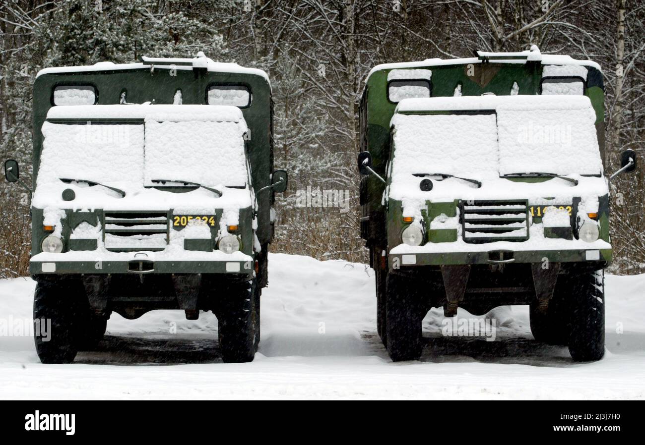 Swedish army trucks on military exercise, Kvarn's firing range. Stock Photo
