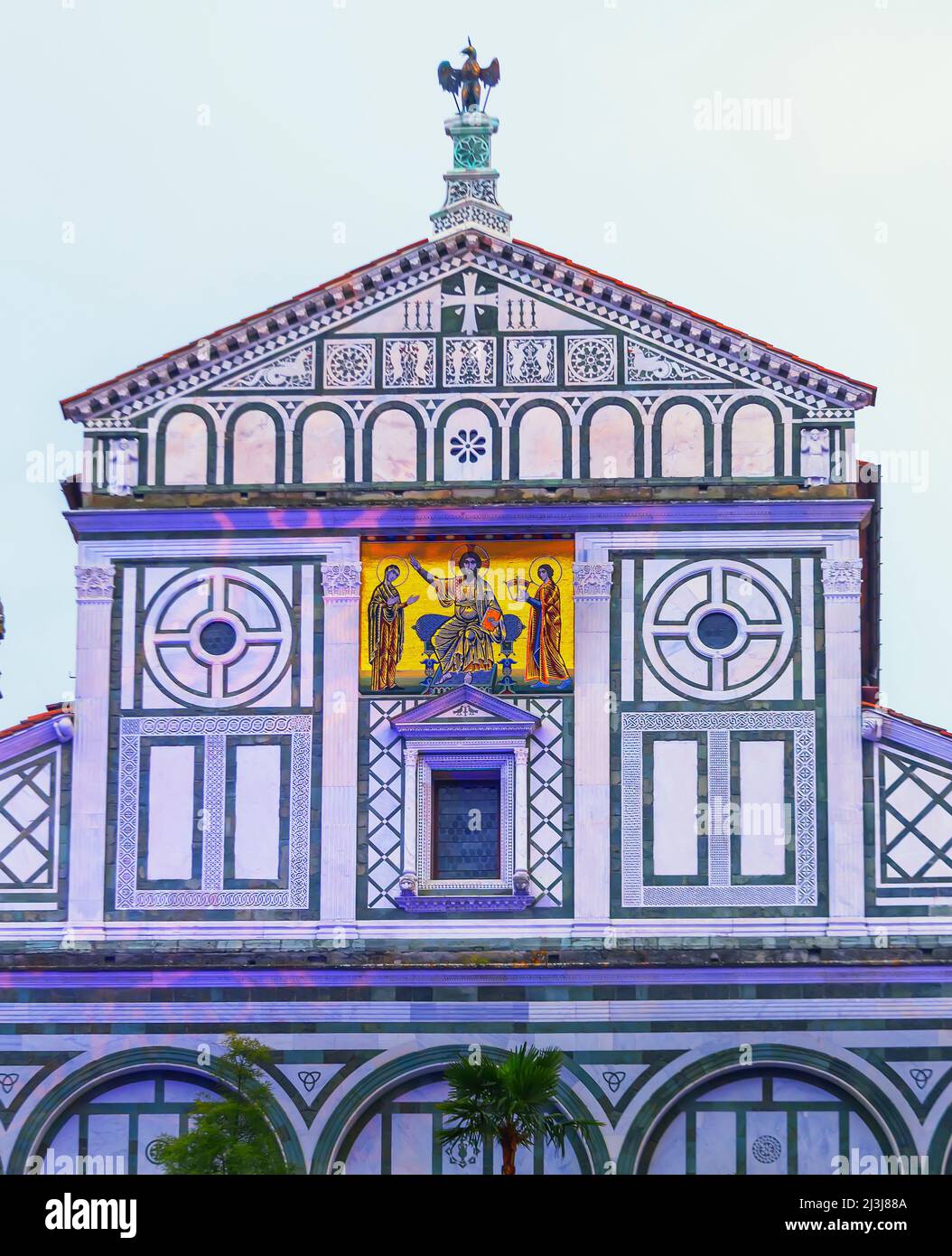 San Miniato al Monte Church facade painted with light, Florence, Tuscany, Italy, Europe Stock Photo