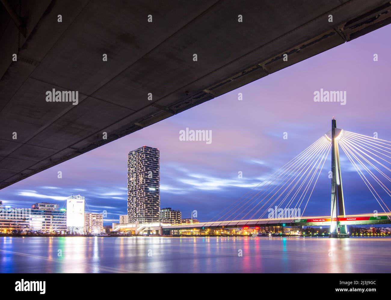 Vienna, river Donau (Danube), bridge Praterbrücke of freeway (above), cable-stayed bridge Donaustadtbrücke for subway line U2, Marinatower, in 02. Leopoldstadt, Austria Stock Photo