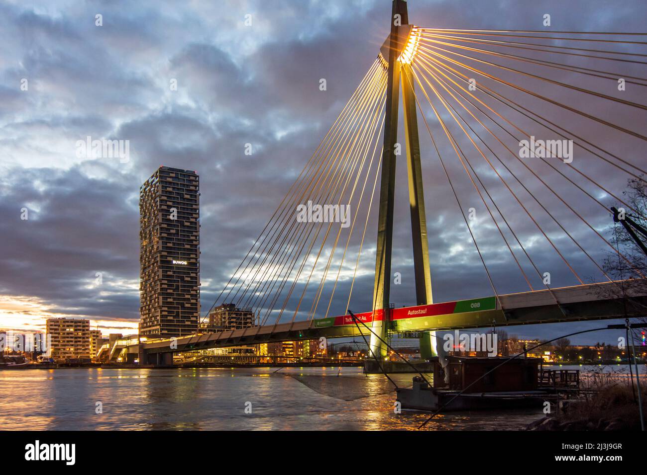 Vienna, river Donau (Danube), cable-stayed bridge Donaustadtbrücke, Marinatower, Daubel lifting net boat, subway line U2, in 02. Leopoldstadt, Austria Stock Photo