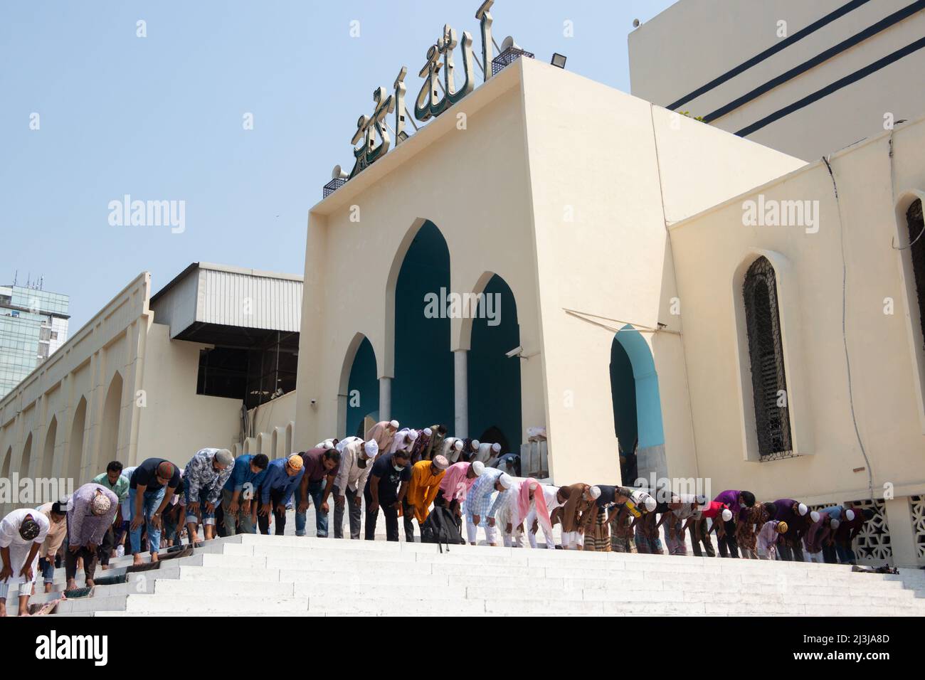 Muslim devotees offer Jummah prayer during the holy month of Ramadan outside of the  Baitul Mukarram National Mosque. On April 8, 2022 in  in Dhaka, B Stock Photo
