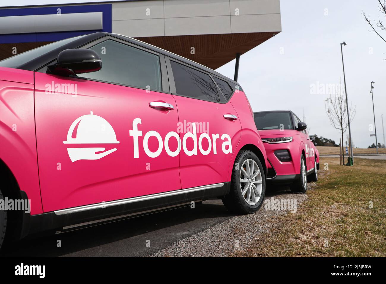 New electric cars, of the brand Kia Soul EV, at a car dealership, for delivery to the company Foodora. The Kia Soul EV (also known as Kia e-Soul) is an all-electric subcompact crossover SUV manufactured by Kia and based on the Kia Soul. Stock Photo