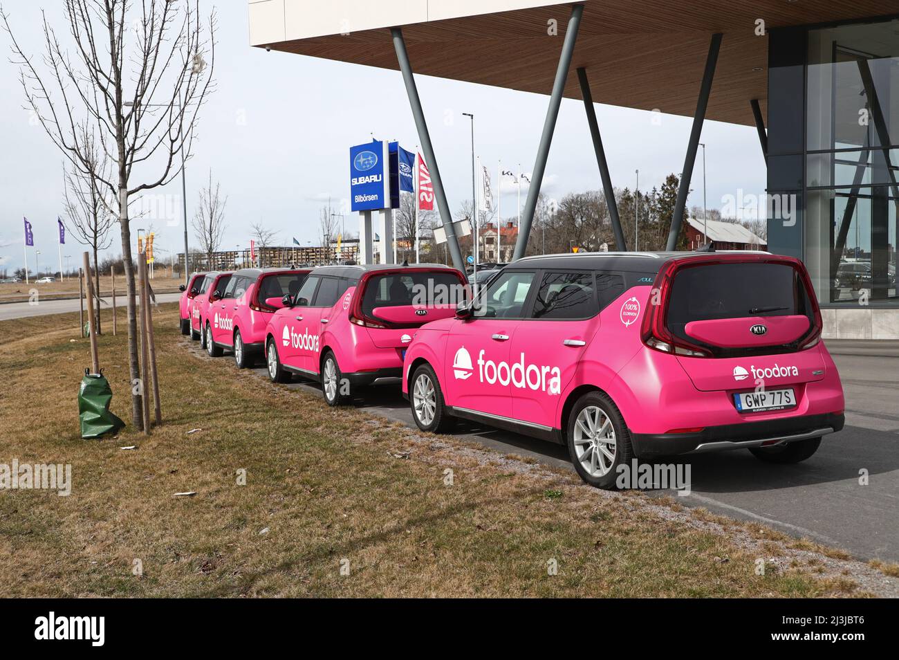 New electric cars, of the brand Kia Soul EV, at a car dealership, for delivery to the company Foodora. The Kia Soul EV (also known as Kia e-Soul) is an all-electric subcompact crossover SUV manufactured by Kia and based on the Kia Soul. Stock Photo