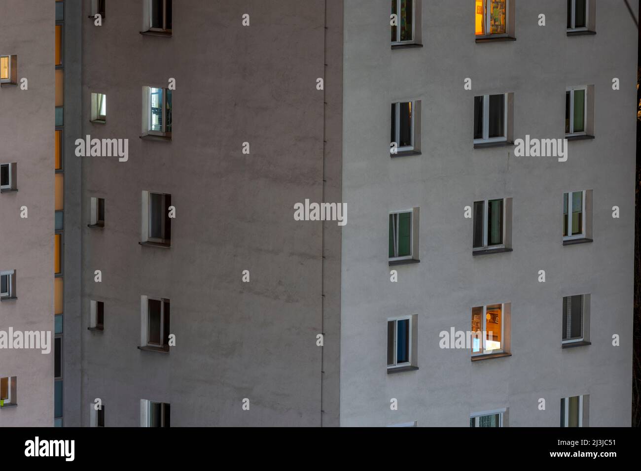 Vienna, residential tower, apartment house with lit windows at night in