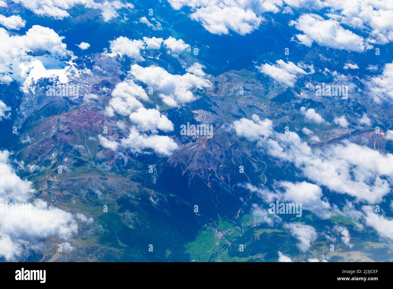 Aerial view of Alps mountains with Reschensee -Lago di Rèsia -Reschensee or Lake Reschen is an artificial lake in the western portion of South Tyrol, Stock Photo
