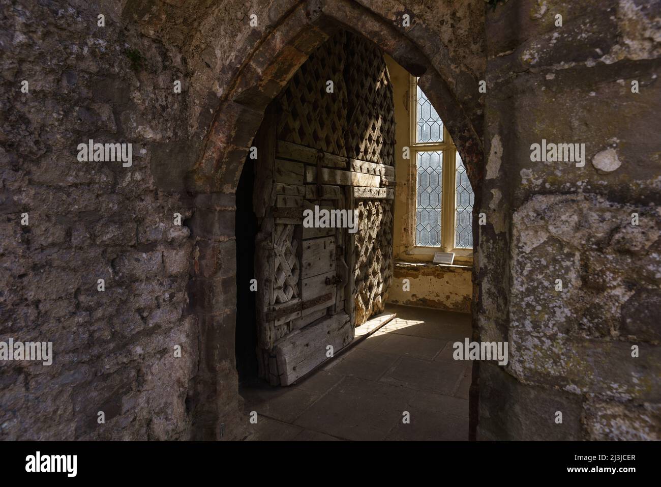 Chepstow Castle, showing the wooden doors, said to be the oldest in Europe. Stock Photo