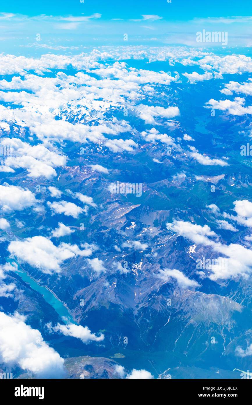 Aerial view of Alps mountains with Reschensee -Lago di Rèsia -Reschensee or Lake Reschen is an artificial lake in the western portion of South Tyrol, Stock Photo