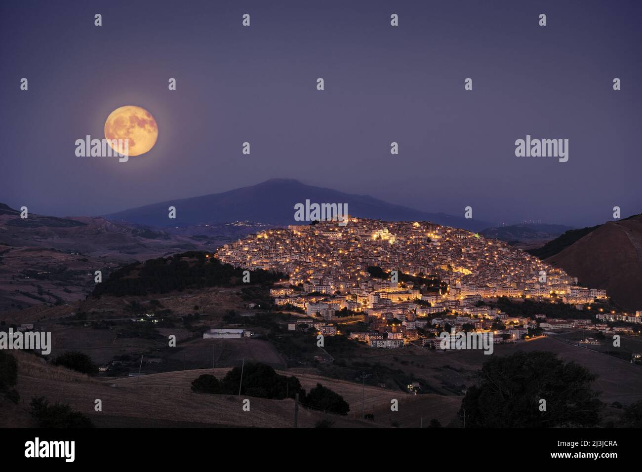 full moon above Gangi village, Sicily Stock Photo