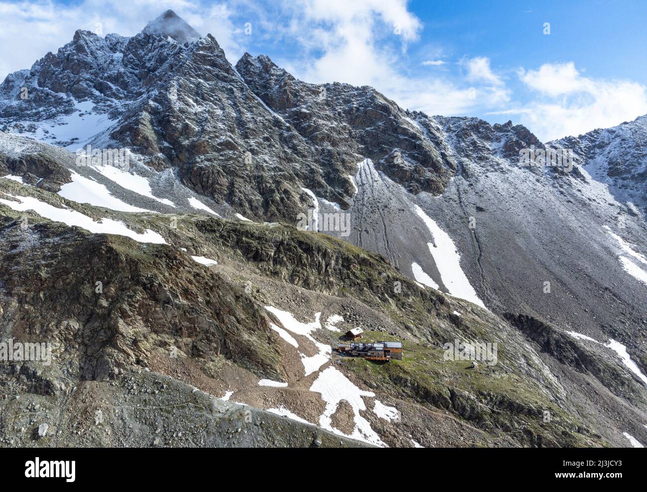 Europe, Alps, Austria, Tyrol, Pitztal, Kaunergrat, view of the Kaunergrat hut in front of the Verpeil peak Stock Photo