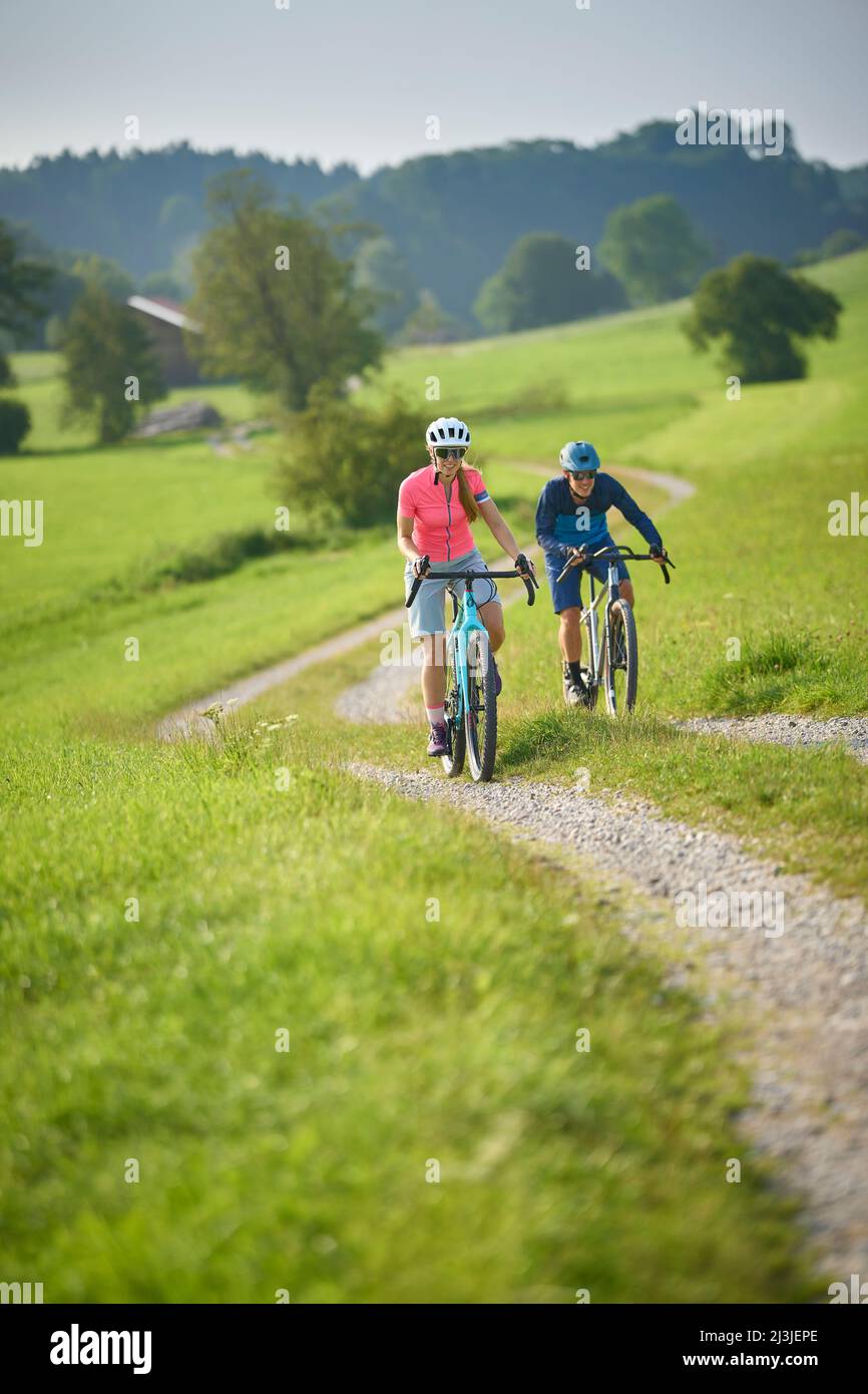 Young couple on gravel bikes, Ambach, Bavaria, Germany Stock Photo Alamy