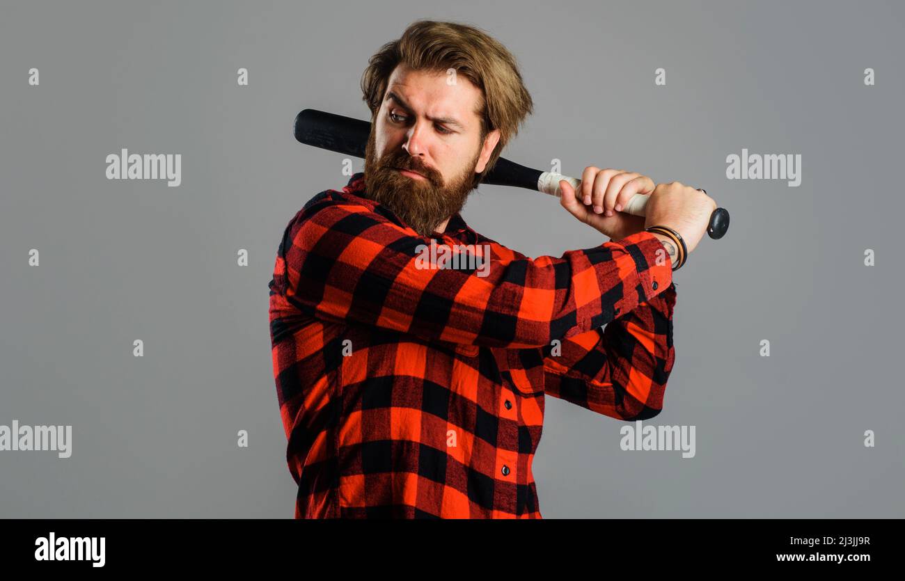 Man swing with baseball bat. Professional baseball player. Sport game. Training, healthy lifestyle. Stock Photo