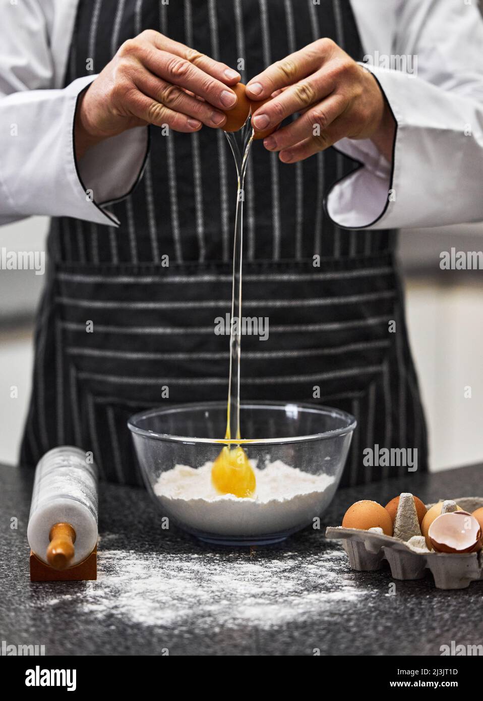 Whatever happens, well always have pasta. Shot of an unrecognisable man preparing freshly made pasta. Stock Photo