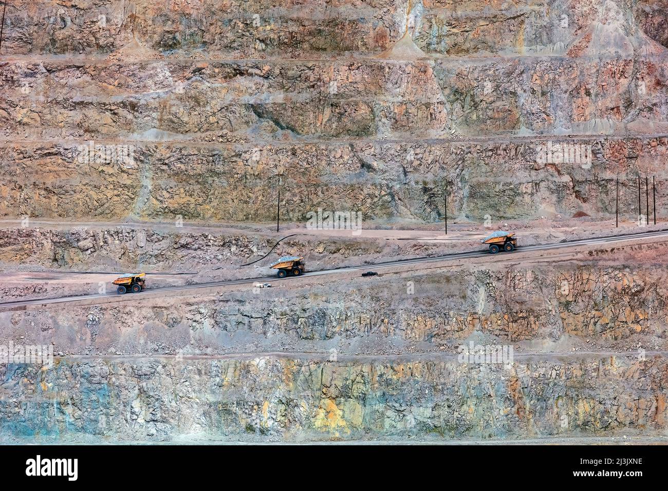 Massive Mining Dump Trucks - Morenci Copper Mine, Arizona  Largest Copper mine in North America Stock Photo