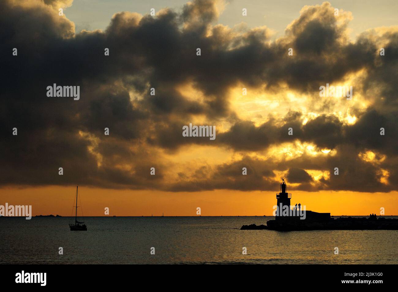Darkness on the lighthouse of Sanary-sur-Mer at sunset, Var, Provence-Alpes-Côte d'Azur, France Stock Photo
