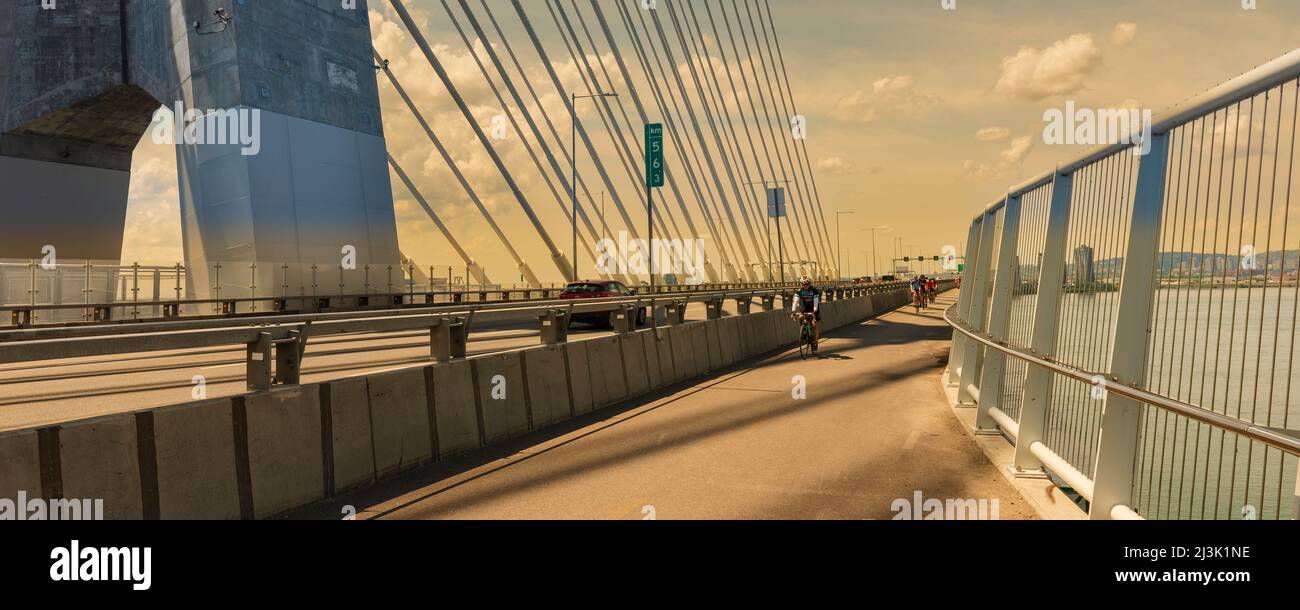 Cycling on the Samuel De Champlain Bridge; Montreal, Quebec, Canada Stock Photo