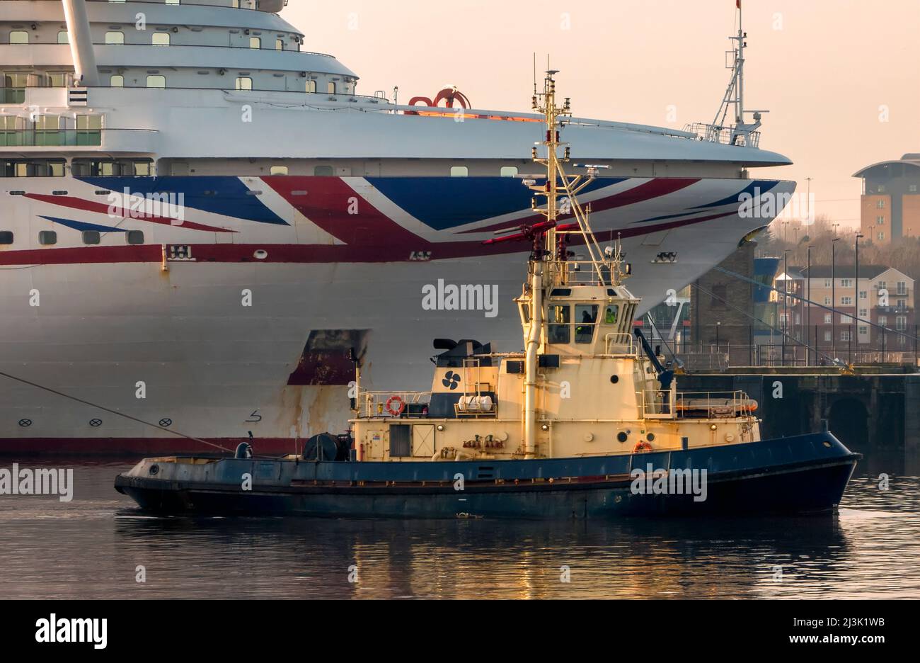 Tug boat and cruise ship in the South Shields harbour; South Shields