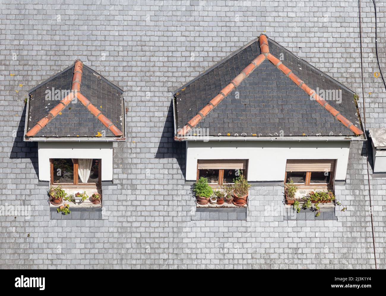 Dormer windows on the roof of a building Stock Photo