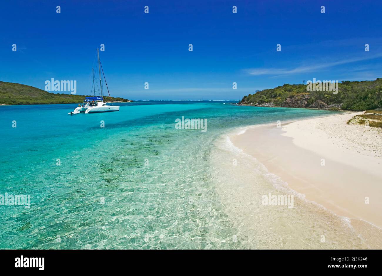 Yacht off Petit Bateau Island, Tobago Cays, in the Southern Grenadines; Petit Bateau Island, Saint Vincent and the Grenadines Stock Photo