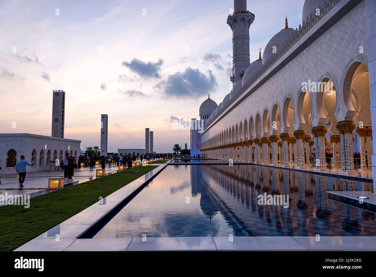 Reflective Pool Mosque Visitors walk past and photograph one of the reflecting pools at the ...