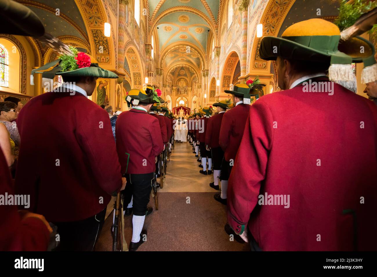 Inside the Mary Immaculate parish church in Weerberg village, local people of the area celebrate Herz-Jusu with a big procession with colour guards, ‘ Stock Photo